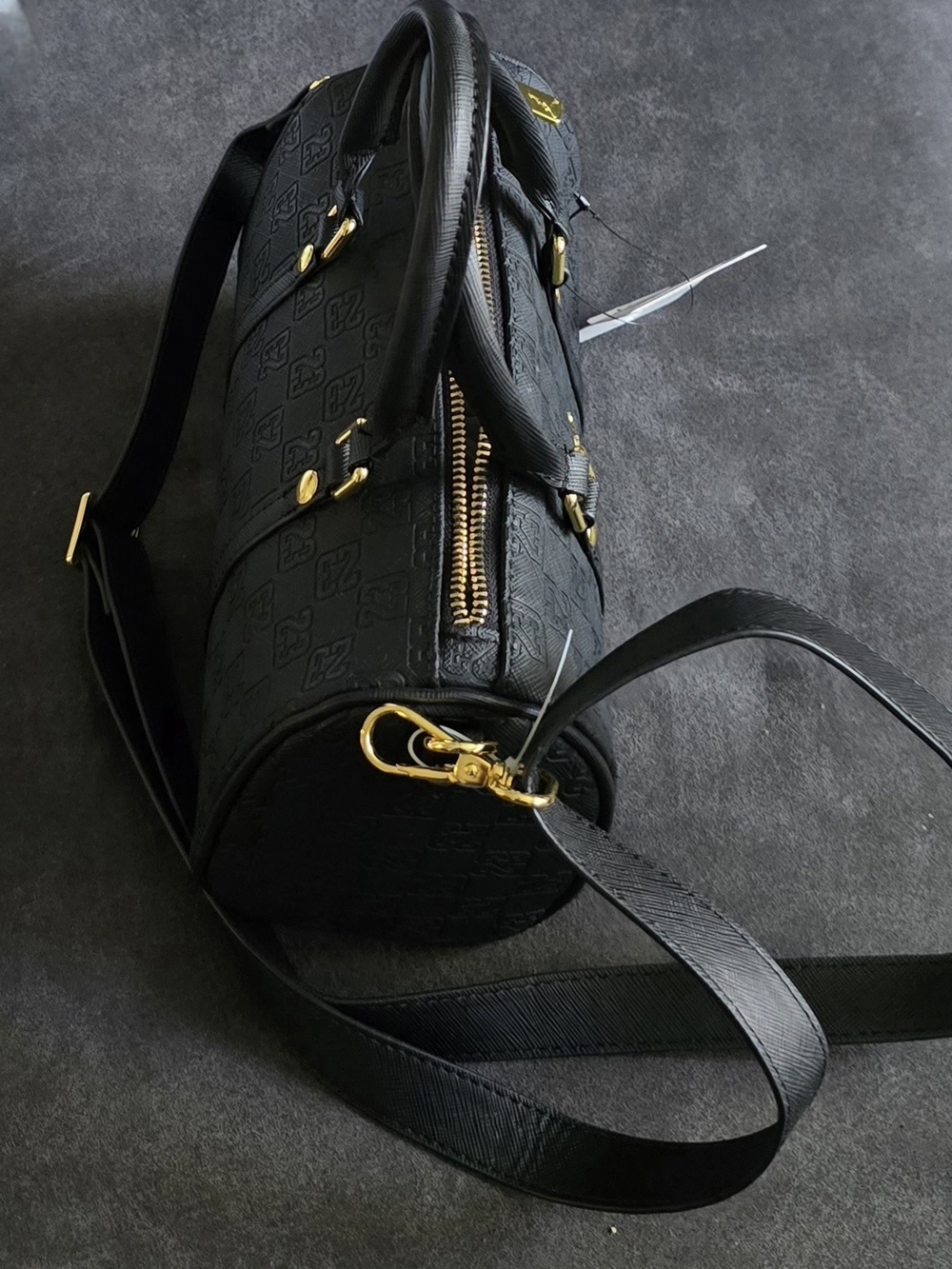 A black Jordan Monogram Mini Duffle Bag With Jump Man On It - Picture 2 of 10